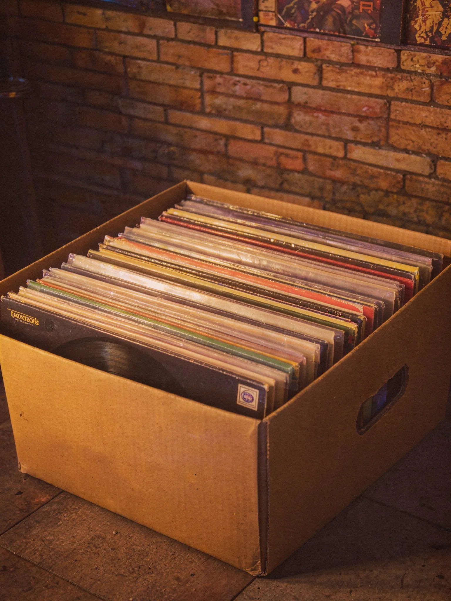 Neon-lit record player in a dark room